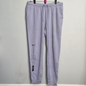 Nike Sportswear Essential Fleece Sweatpants In A Lavender With Graphic Print.